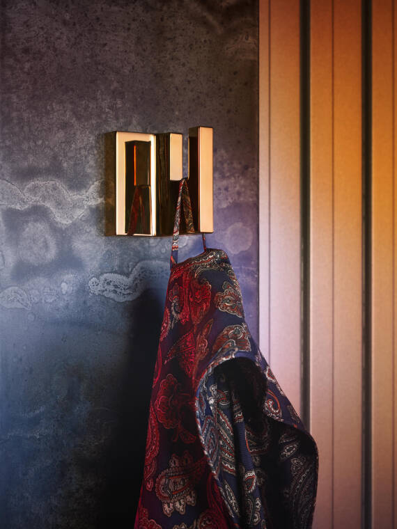 The AXOR Universal Rectangular towel rail in Polished Gold Optic.