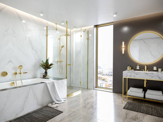 hansgrohe dream bathroom with gold-colored faucets.