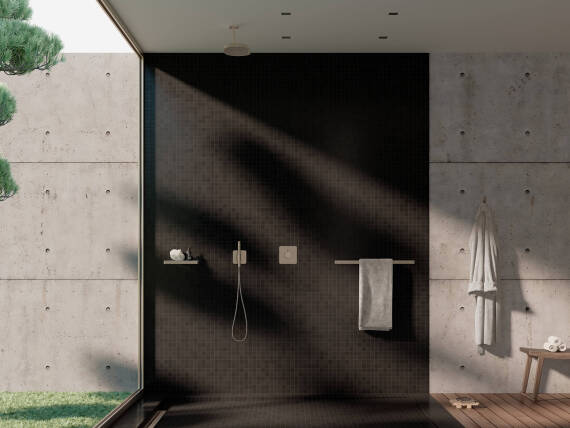 暗色背景下的雅生 ShowerSphere 和雅生奇特里奥 C 暗装淋浴龙头的照片